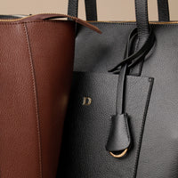 Close up view of black and brown Emma Pebble Leather Tote Bag by Danilos