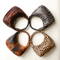 Four Danilos handbags with leopard print, stripped patterns and spots on a white background
