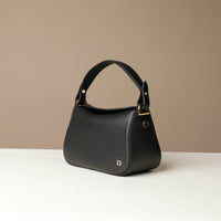 Satchel hold bag in leather, shown in black, side profile view 