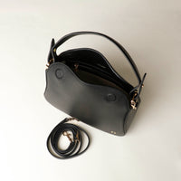 Satchel hold bag in leather, shown in black, open at the top