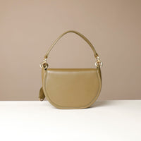 Green Danilos handbag on a beige background