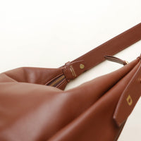 Mini Mia Minimale Jr Brown leather bag with visible brand logo Danilos on a white background
