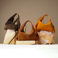 three handbags hobo bag top-handle bag, mini mia minimale, suede leather, brown, tan, dark olive, on a rock, with visible brand Danilos