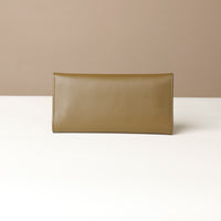 Back view of the Danilos Leather jewelry organizer Mishka in green in a beige background