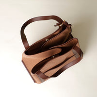 Close-up of handle attachment on Isola tote bag