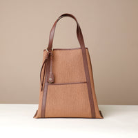 Close-up of hardware and leather on Isola tote bag