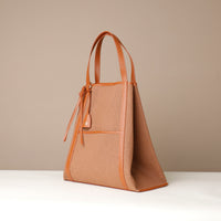 Side view of Tosca Isola mesh tote bag with leather trims