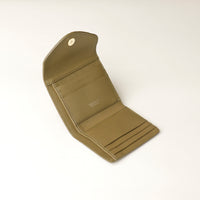 Open green leather danilos wallet on a white background