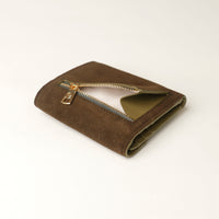 green suede leather danilos wallet with a gold zipper opened on a white background