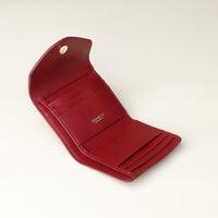Red opened leather wallet with danilos logo on a light beige background