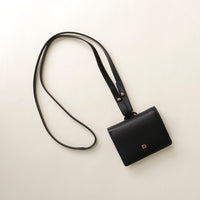 Styled front shot of Olivia wallet crossbody in premium leather