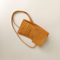 Lifestyle shot of Olivia wallet crossbody worn crossbody