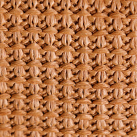 Close up of the woven wallet with natural fibers and leather